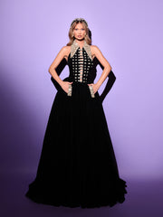 black evening gown featuring golden details 