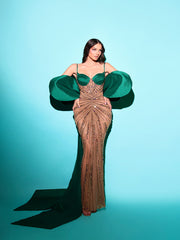 nude evening gown featuring green details 