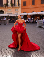 red evening gown featuring an off-shoulder neckline and a long train