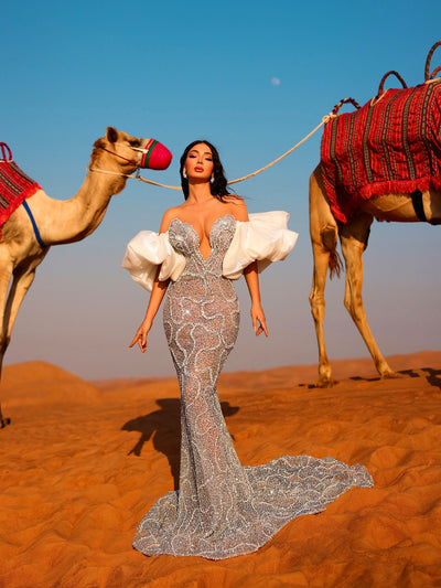 silvery evening gown featuring white puff sleeves