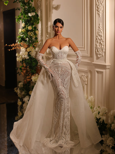 bridal gown featuring opera gloves and a removable train