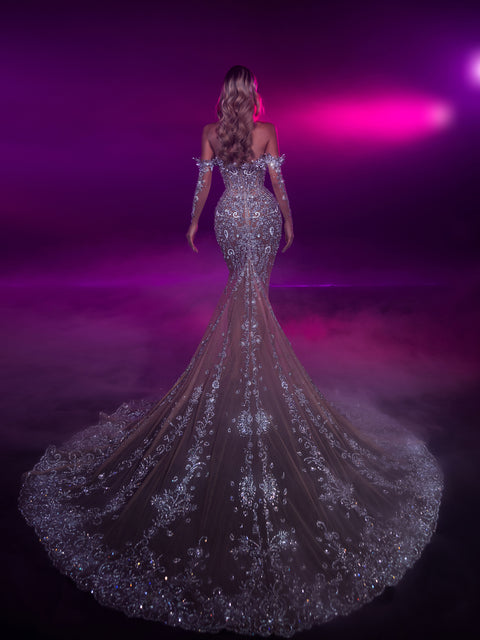 nude evening gown featuring a long train